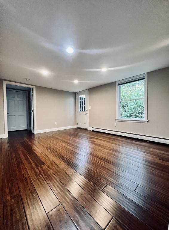 166 Pleasant Street, Unit 1 Marblehead, MA 01945 - Photo 5 of 10 a view of empty room with wooden floor and fan