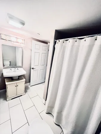 a bathroom with a bathtub sink and toilet