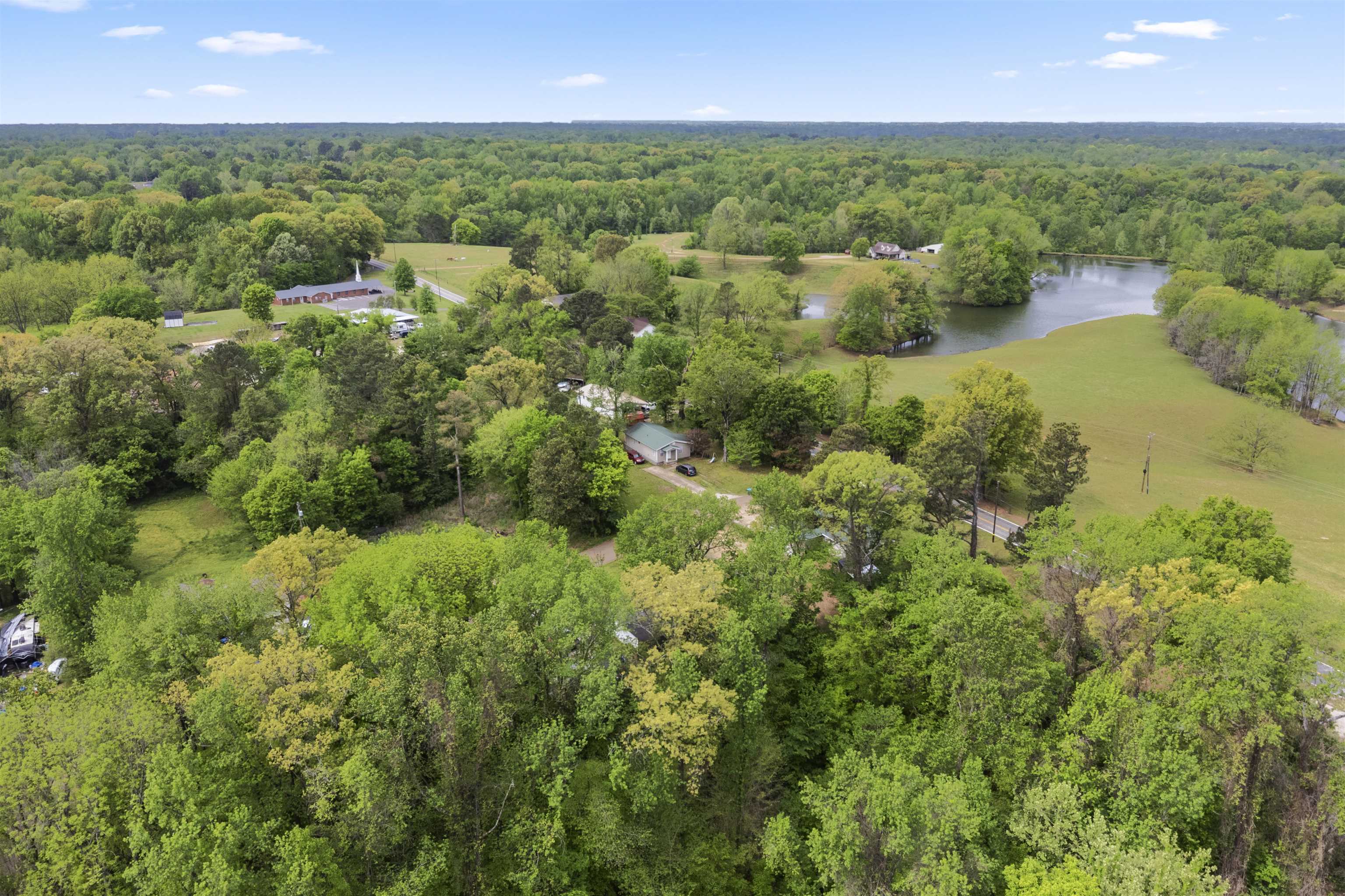 17 Walnut Road Munford, TN 38058 - Photo 13 of 20 Aerial view of a nearby body of water and a heavily wooded area