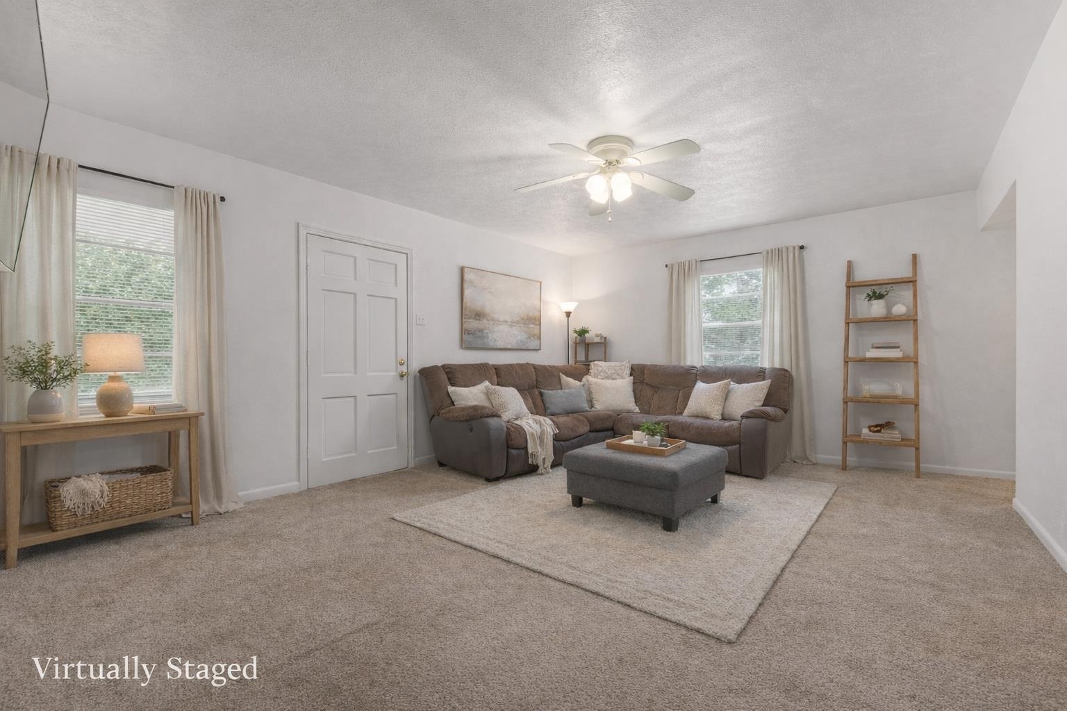 17 Walnut Road Munford, TN 38058 - Photo 3 of 20 Living area with ceiling fan, carpet flooring, and a textured ceiling