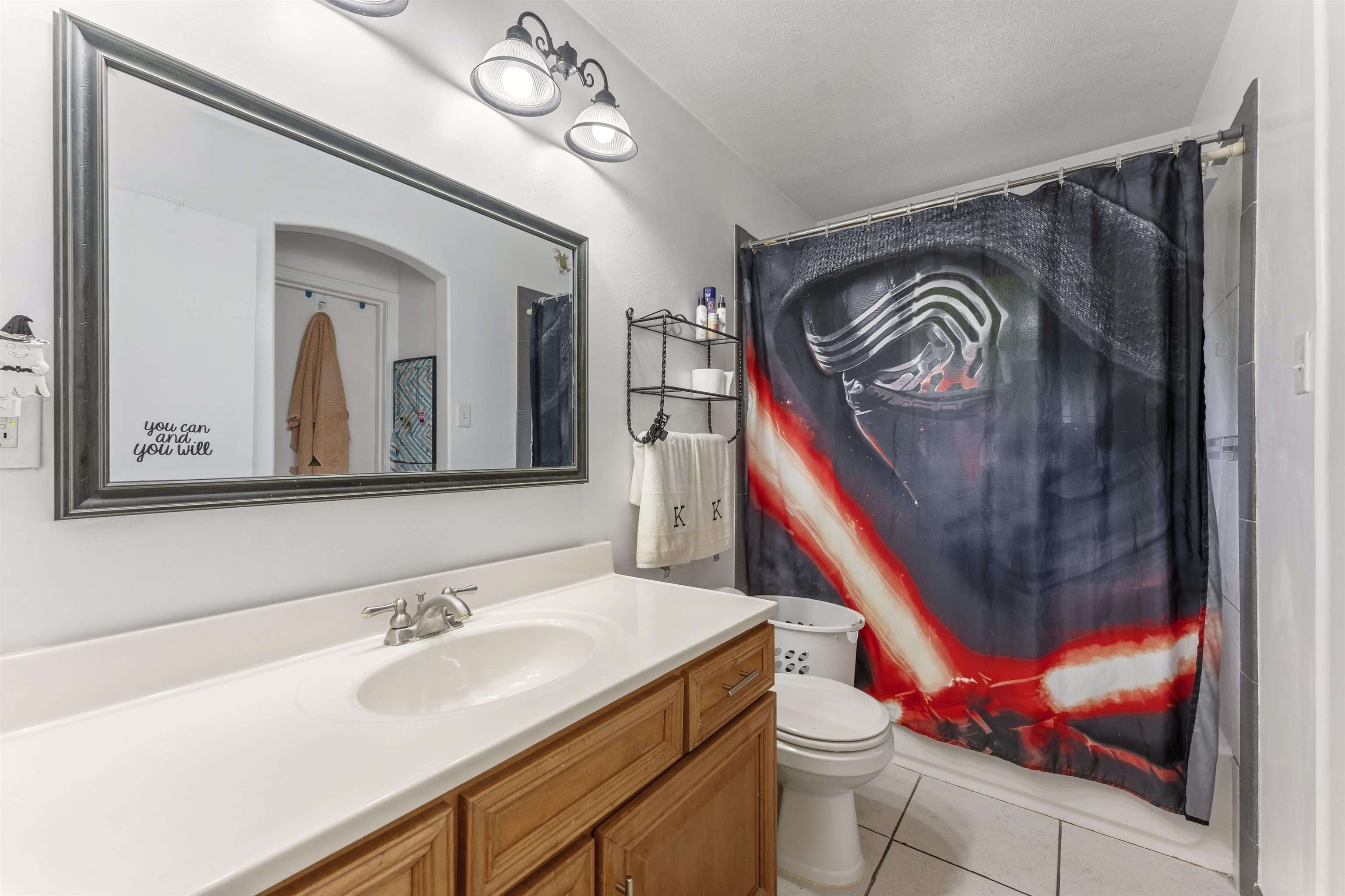 17 Walnut Road Munford, TN 38058 - Photo 8 of 20 Bathroom featuring vanity, light tile patterned flooring, and shower / tub combo