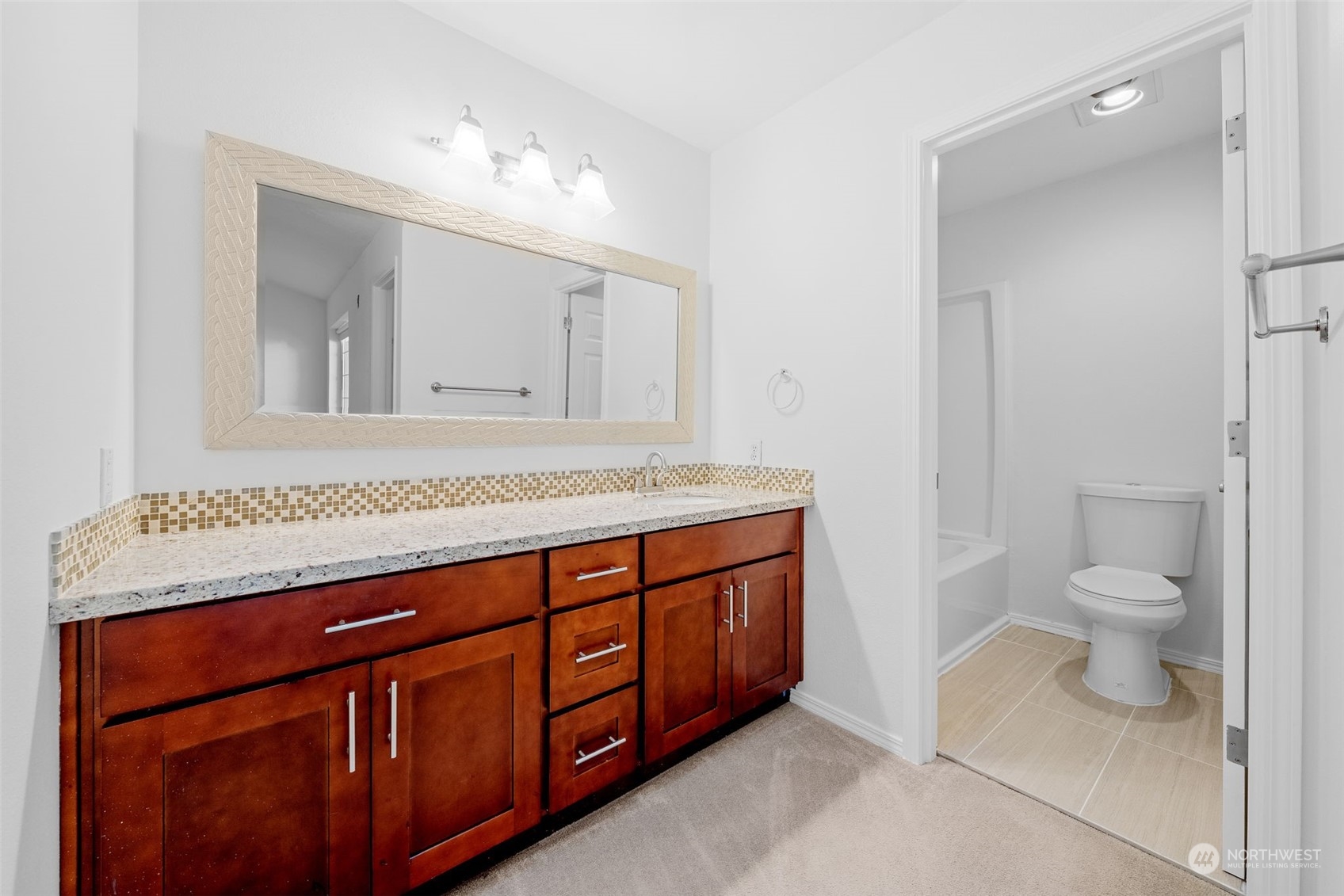 1921 South 368th Place Federal Way, WA 98003 - Photo 13 of 20 a spacious bathroom with a granite countertop sink and a mirror