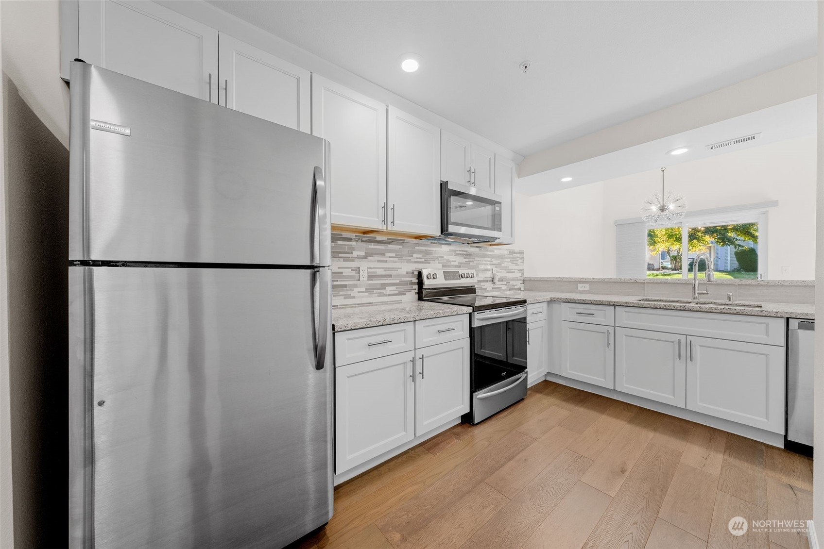 1921 South 368th Place Federal Way, WA 98003 - Photo 8 of 20 a kitchen with white cabinets and white appliances