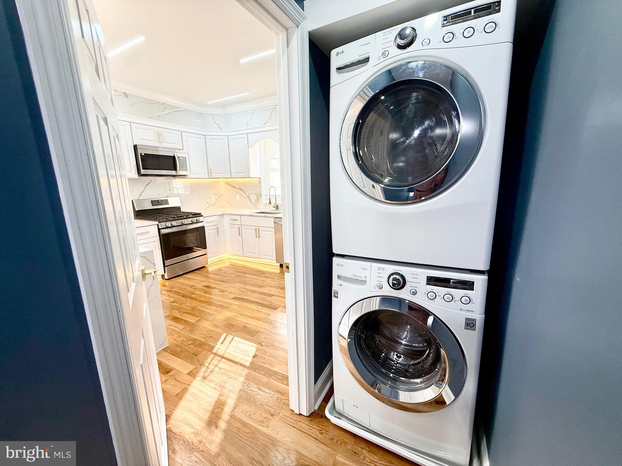 1942 South 56th Street Philadelphia, PA 19143 - Photo 17 of 36 a view of a kitchen with washer and dryer