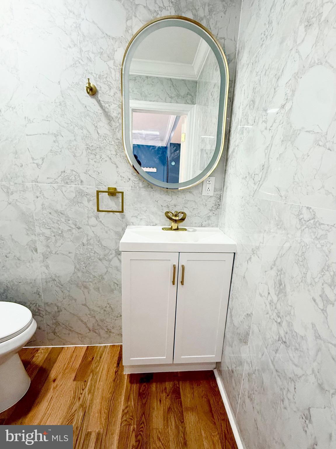 1942 South 56th Street Philadelphia, PA 19143 - Photo 21 of 36 a bathroom with a sink and a mirror