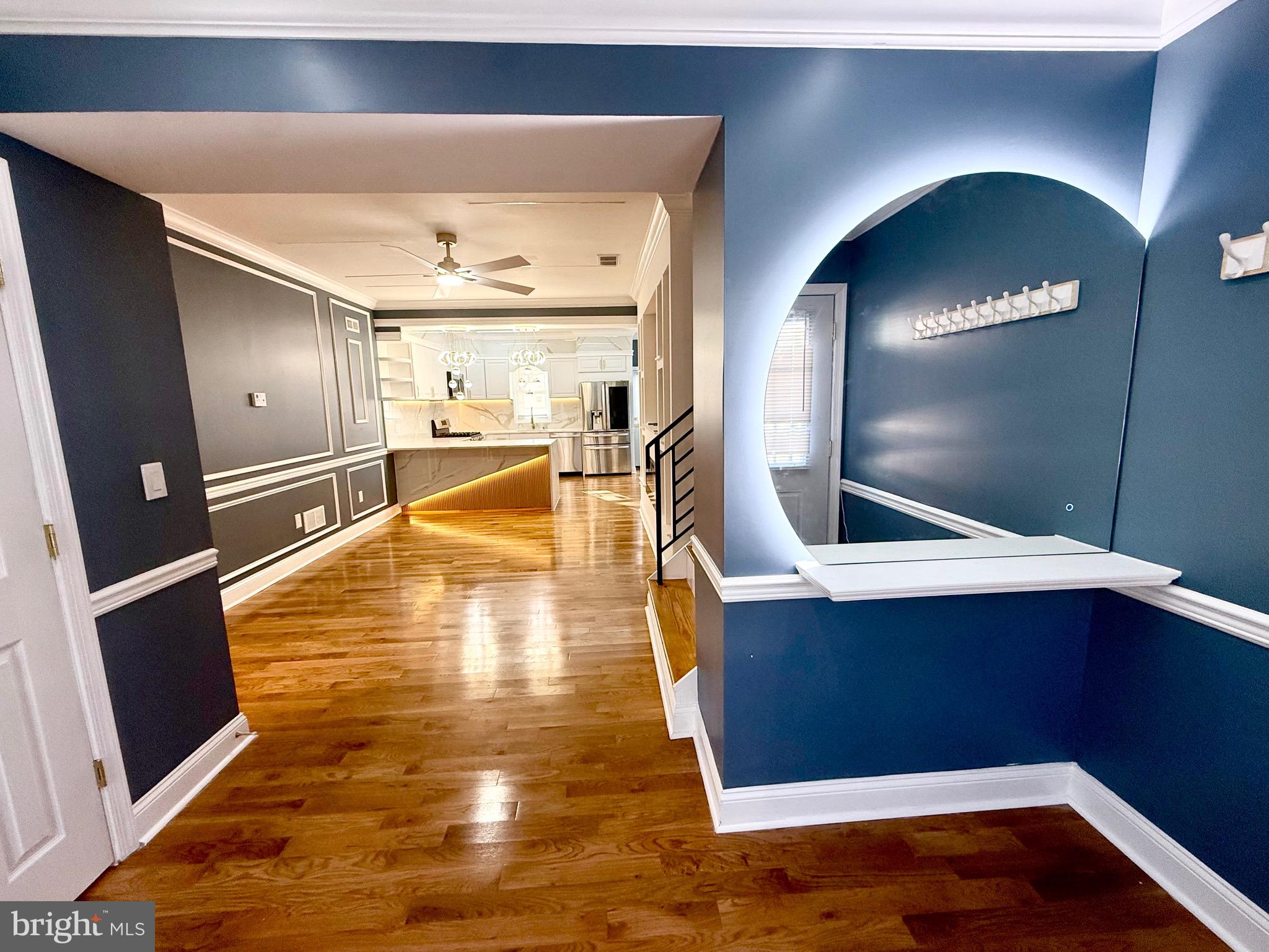 1942 South 56th Street Philadelphia, PA 19143 - Photo 3 of 36 a view of a hallway with wooden floor and staircase