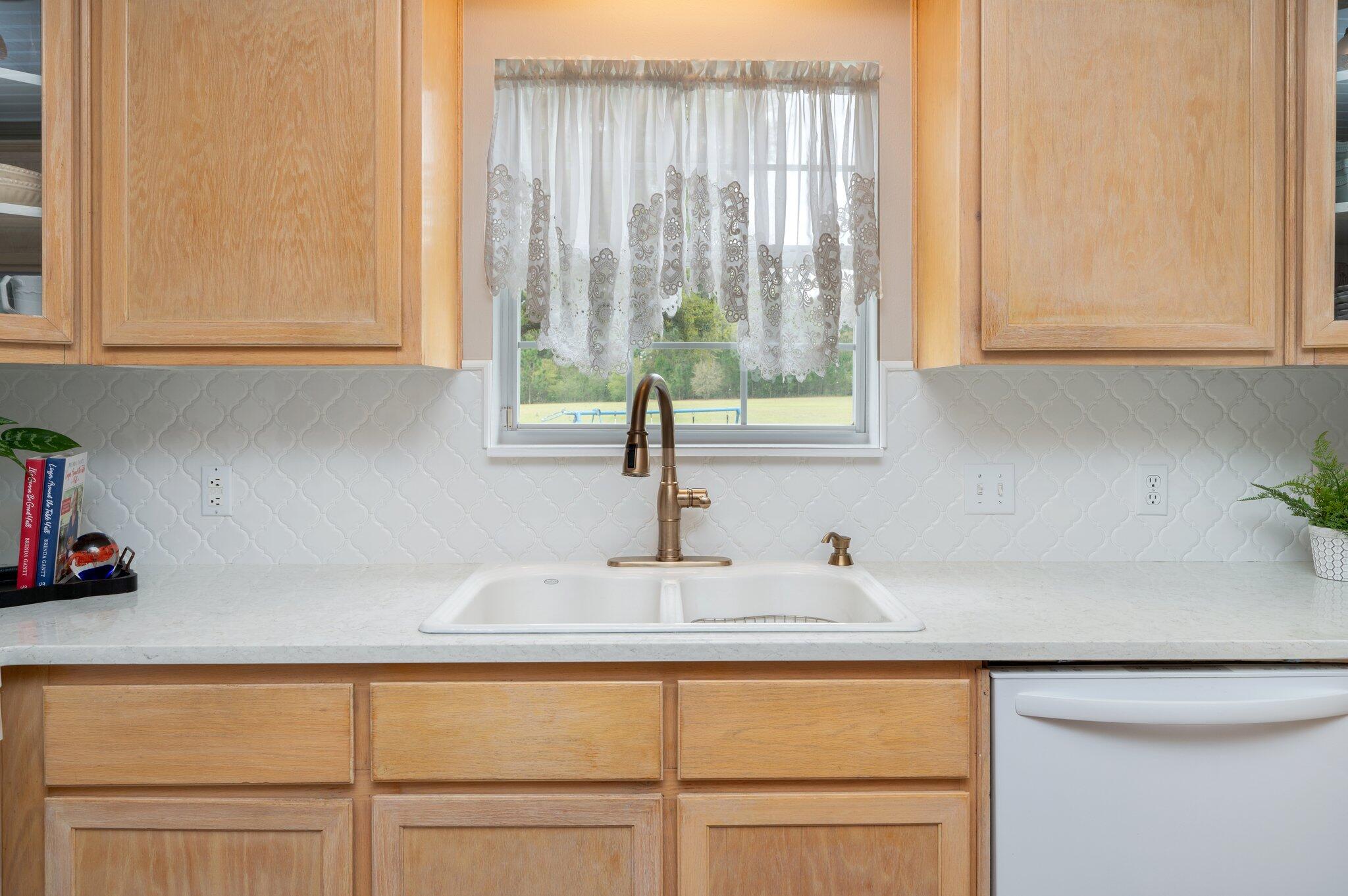 5847 Dairy Road Baker, FL 32531 - Photo 16 of 72 a kitchen with a sink and a window
