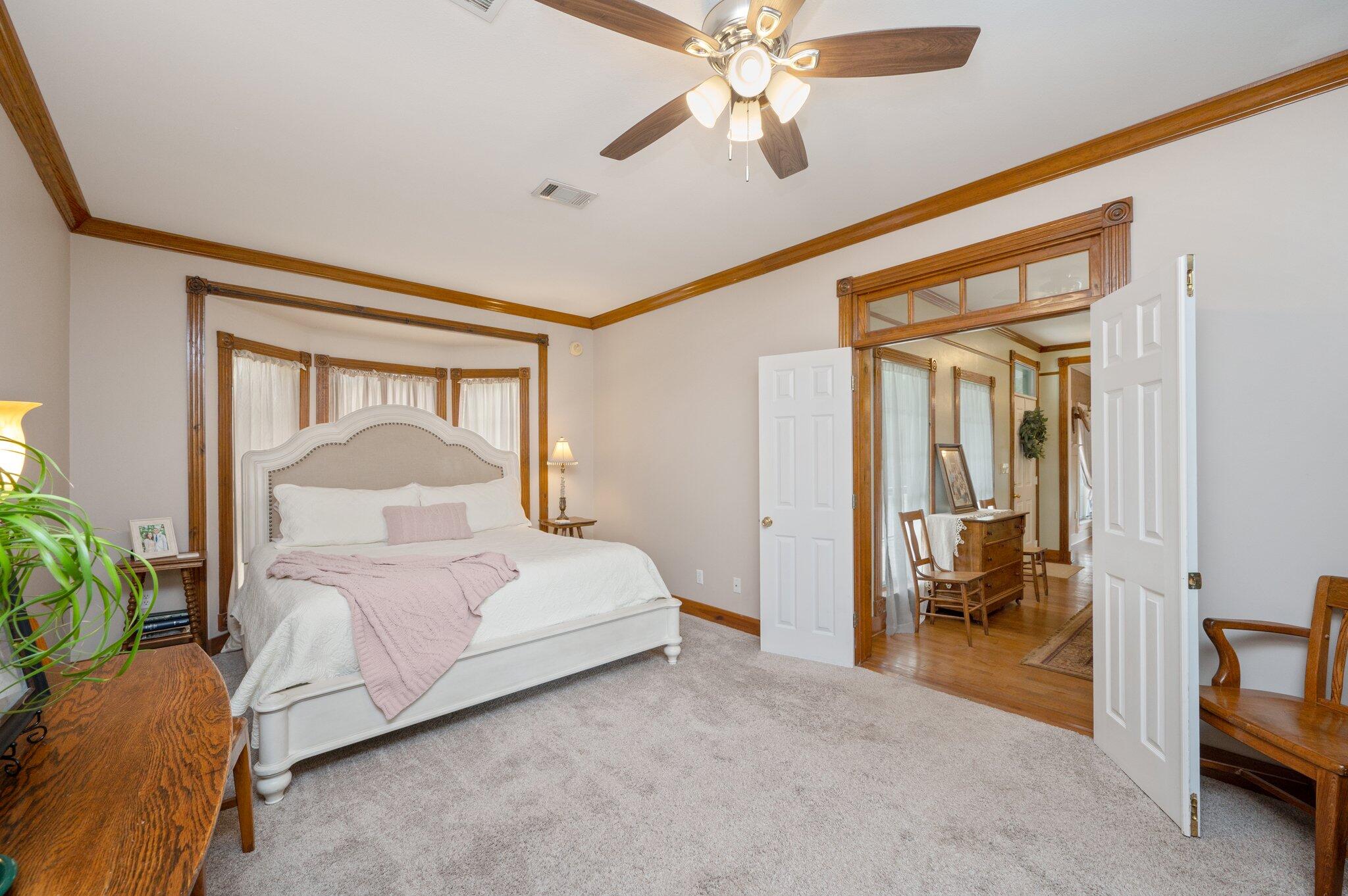 5847 Dairy Road Baker, FL 32531 - Photo 21 of 72 a bedroom with a bed and a chandelier
