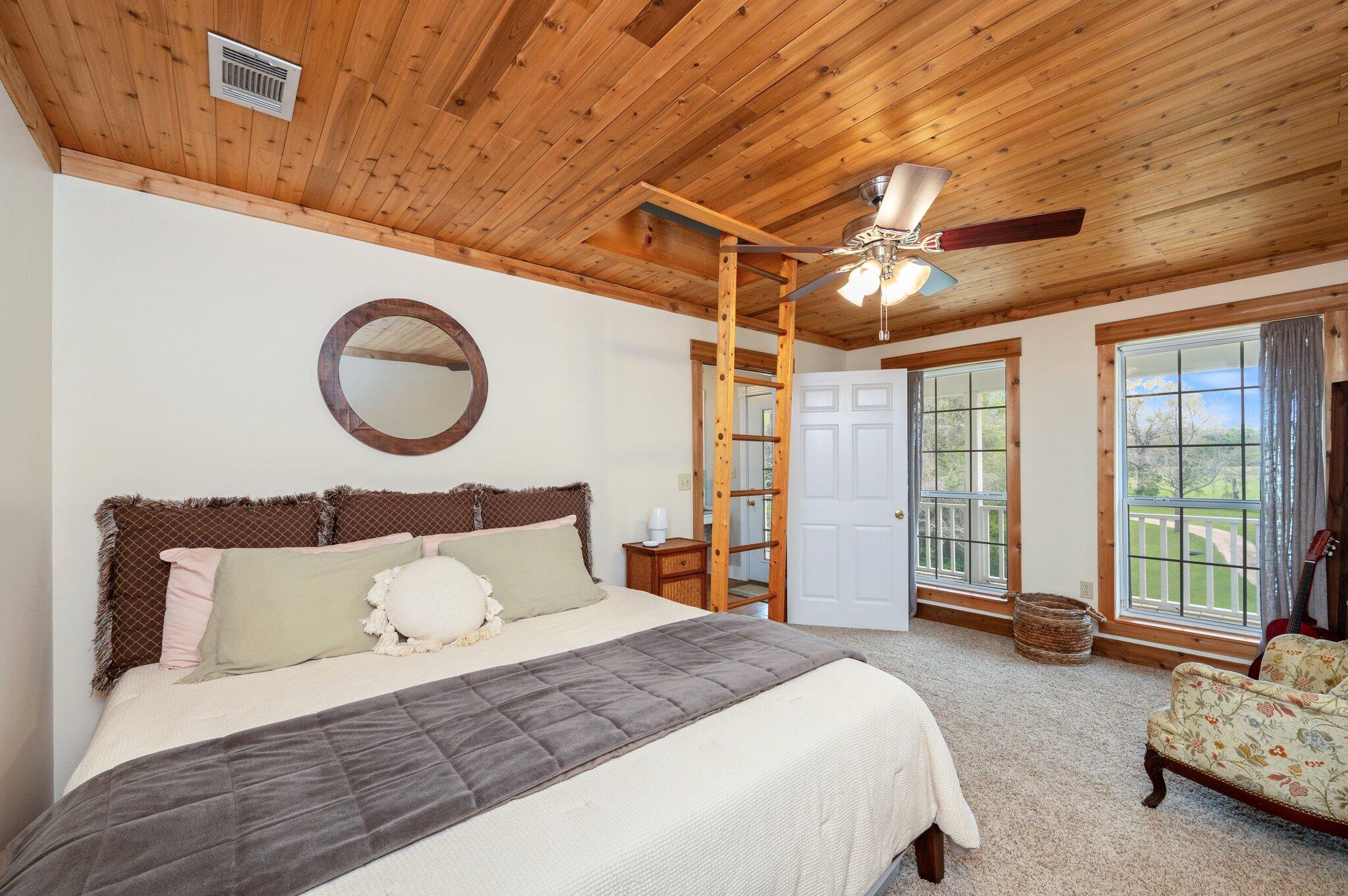 5847 Dairy Road Baker, FL 32531 - Photo 36 of 72 a spacious bedroom with a bed and a large window