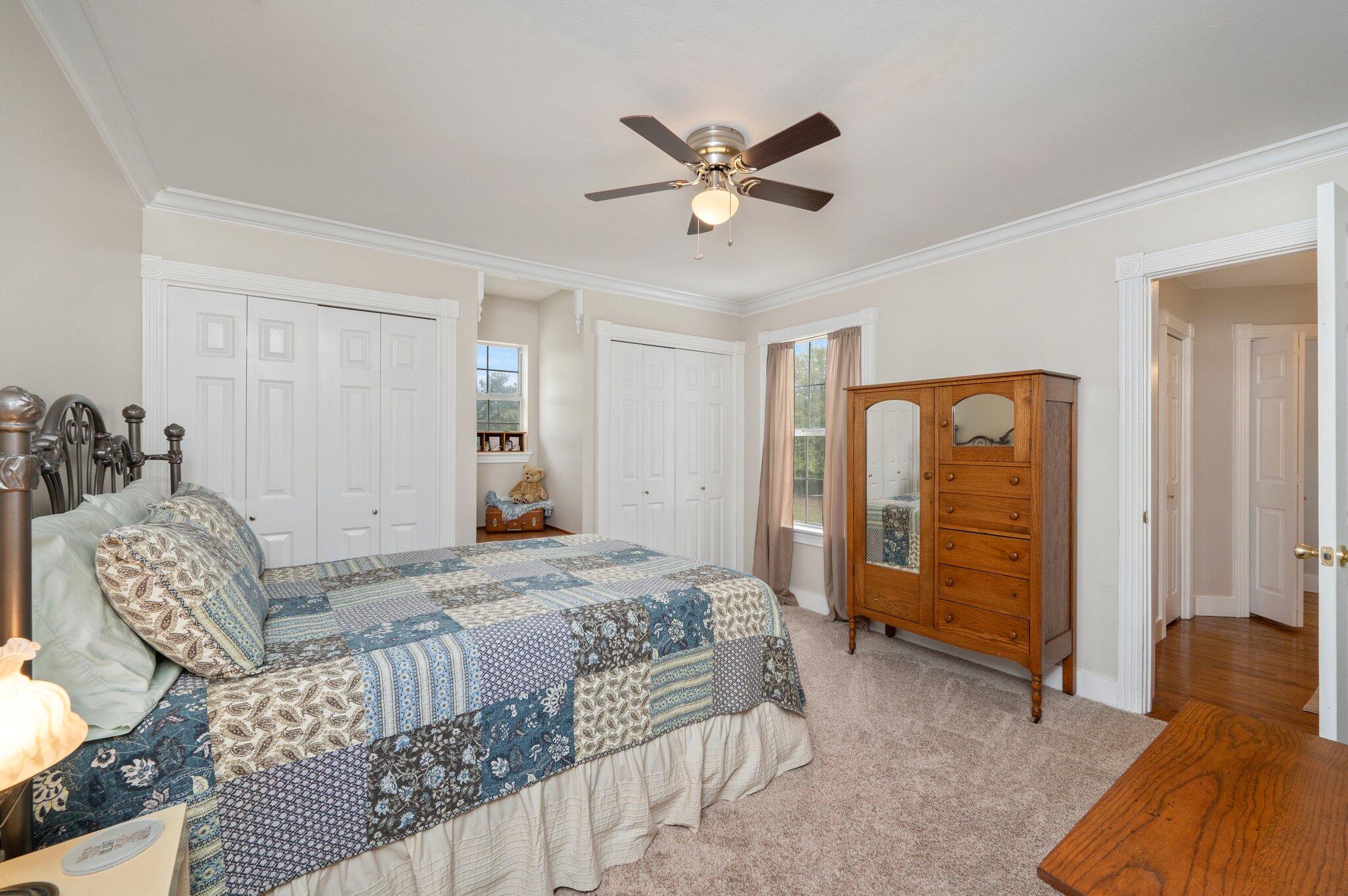 5847 Dairy Road Baker, FL 32531 - Photo 44 of 72 a bedroom with a bed and a chandelier