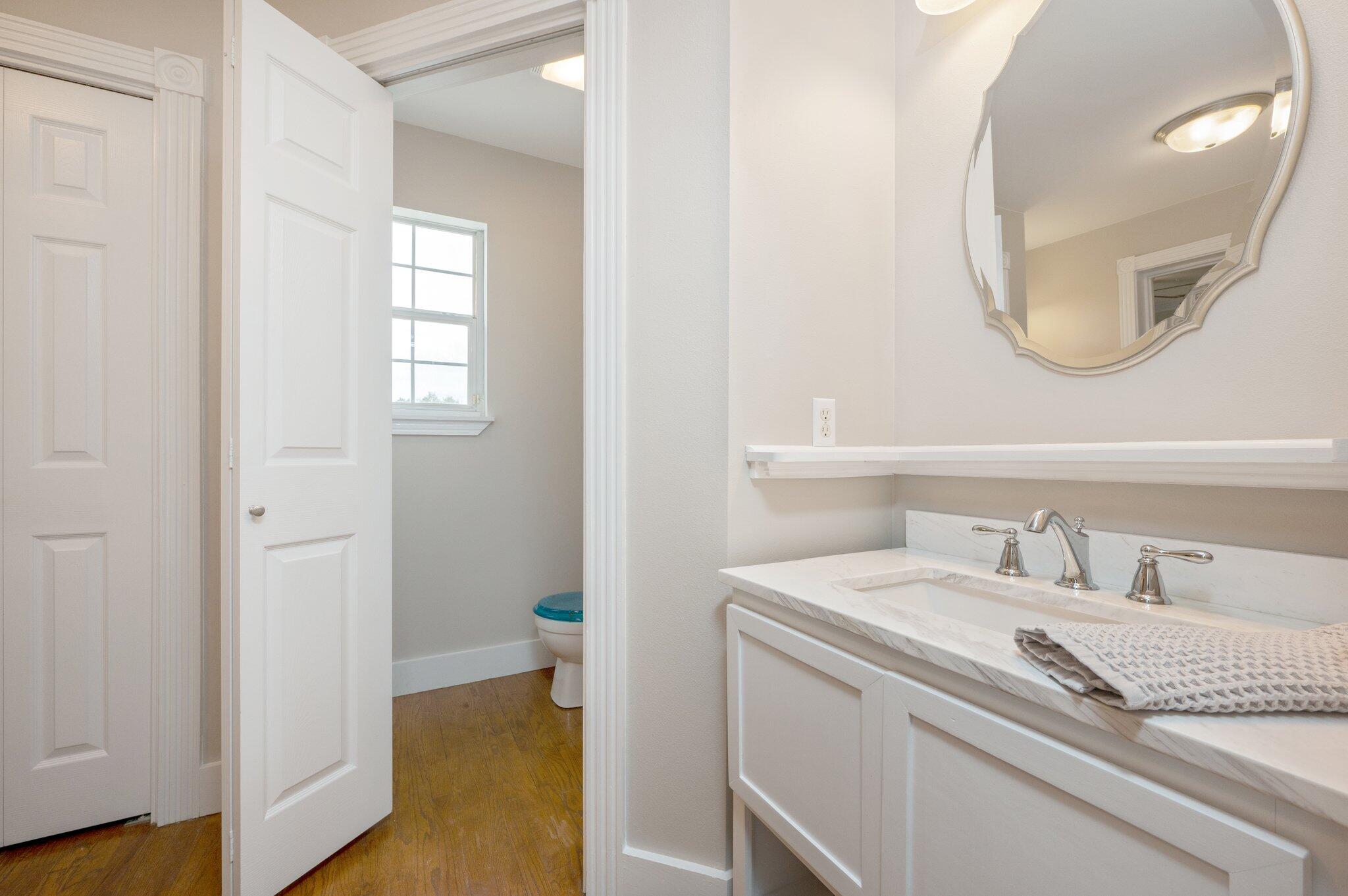 5847 Dairy Road Baker, FL 32531 - Photo 47 of 72 a en suite bathroom with a sink and a mirror