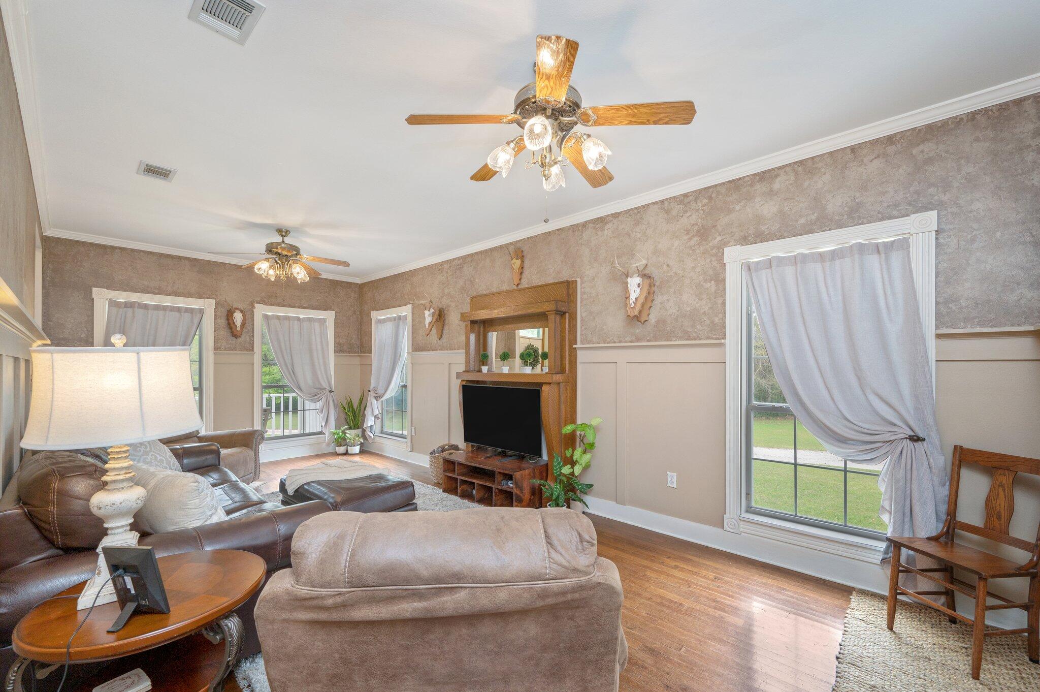 5847 Dairy Road Baker, FL 32531 - Photo 6 of 72 a living room with furniture and a flat screen tv