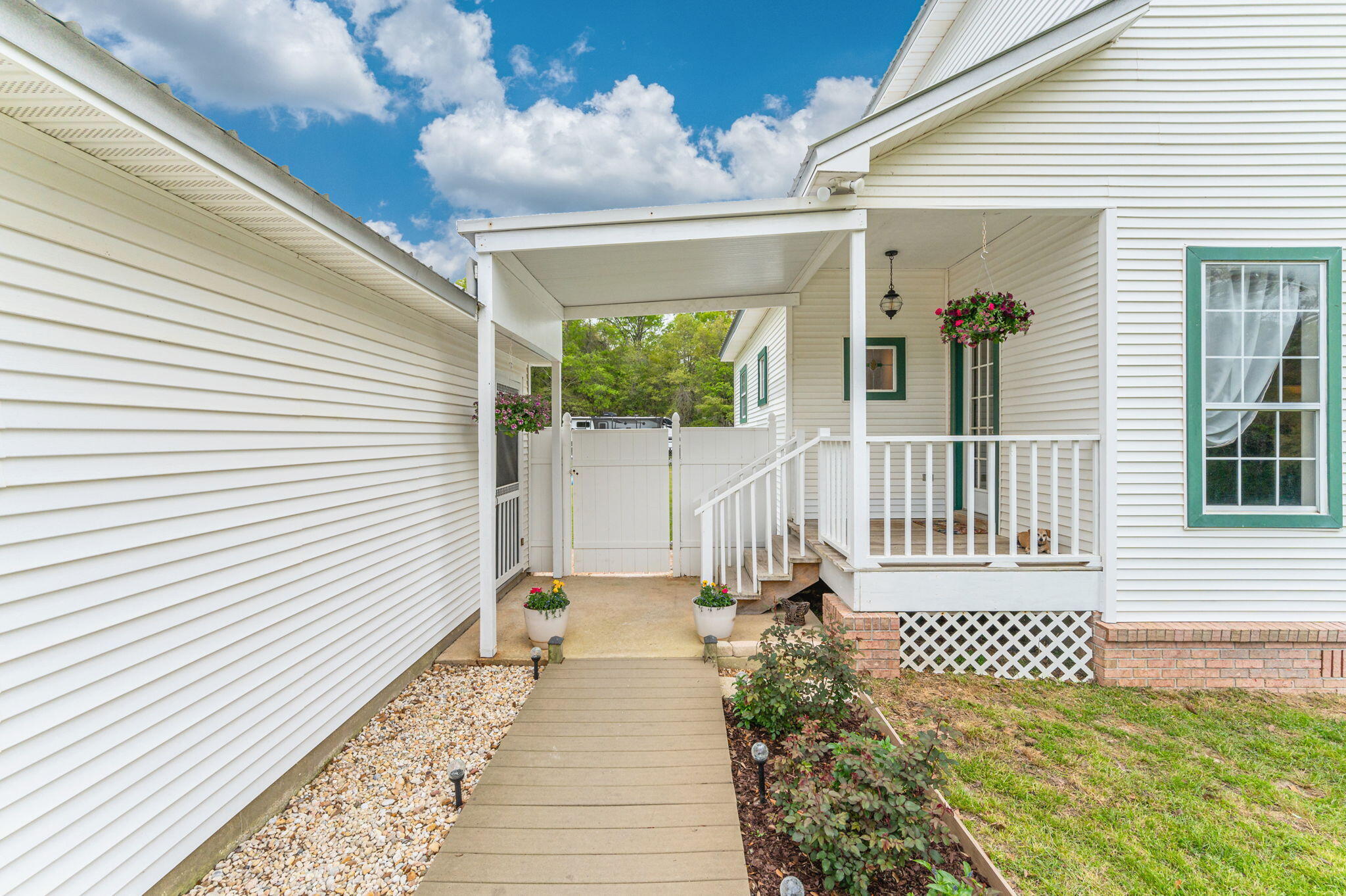 5847 Dairy Road Baker, FL 32531 - Photo 64 of 72 a front view of a house with a porch