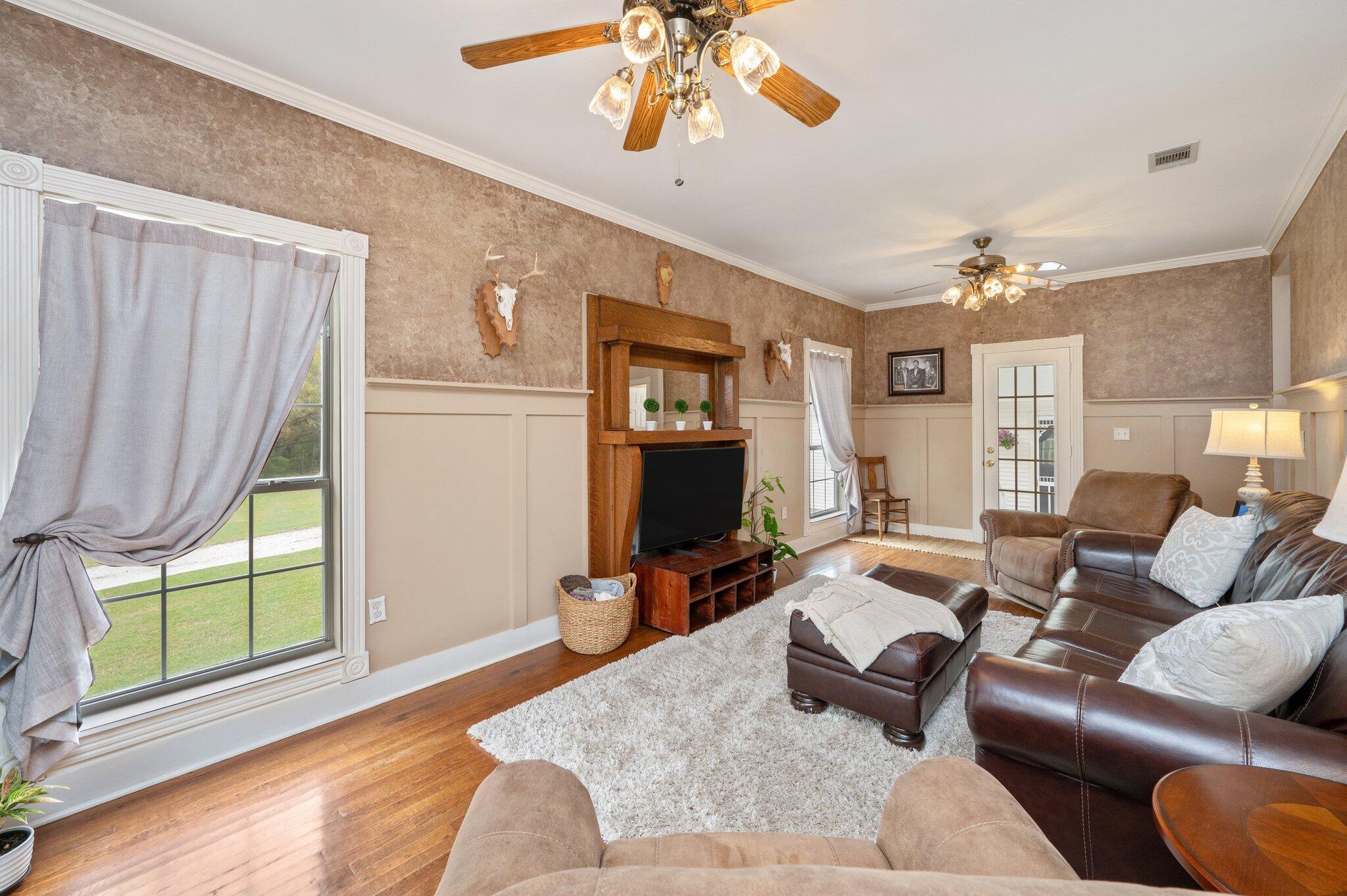 5847 Dairy Road Baker, FL 32531 - Photo 8 of 72 a living room with furniture a window and a chandelier