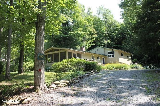 40 Williams Road Becket, MA 01223 - Photo 2 of 18 a front view of a house with a yard and trees