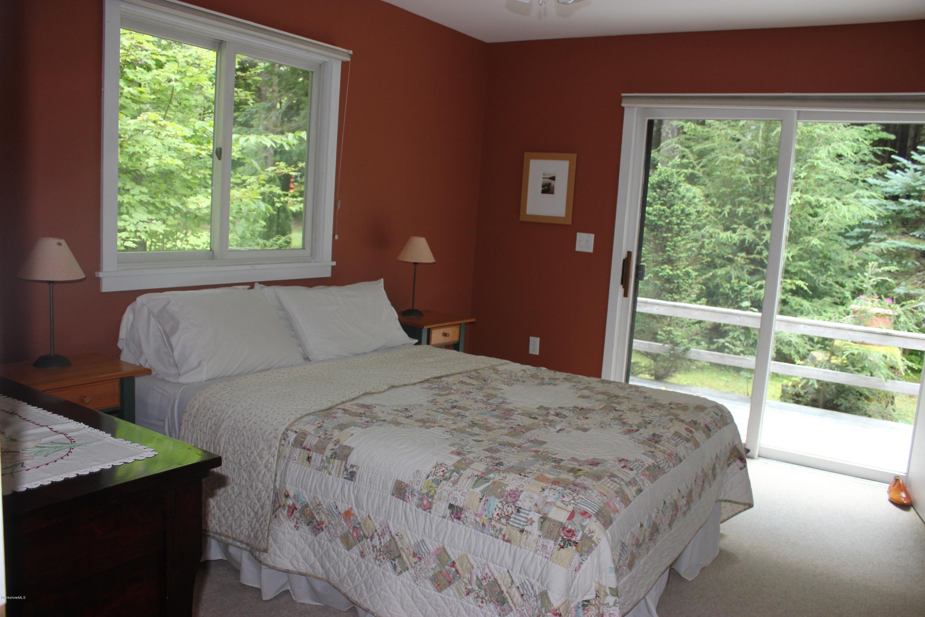 40 Williams Road Becket, MA 01223 - Photo 13 of 18 a bedroom with a bed and a large window