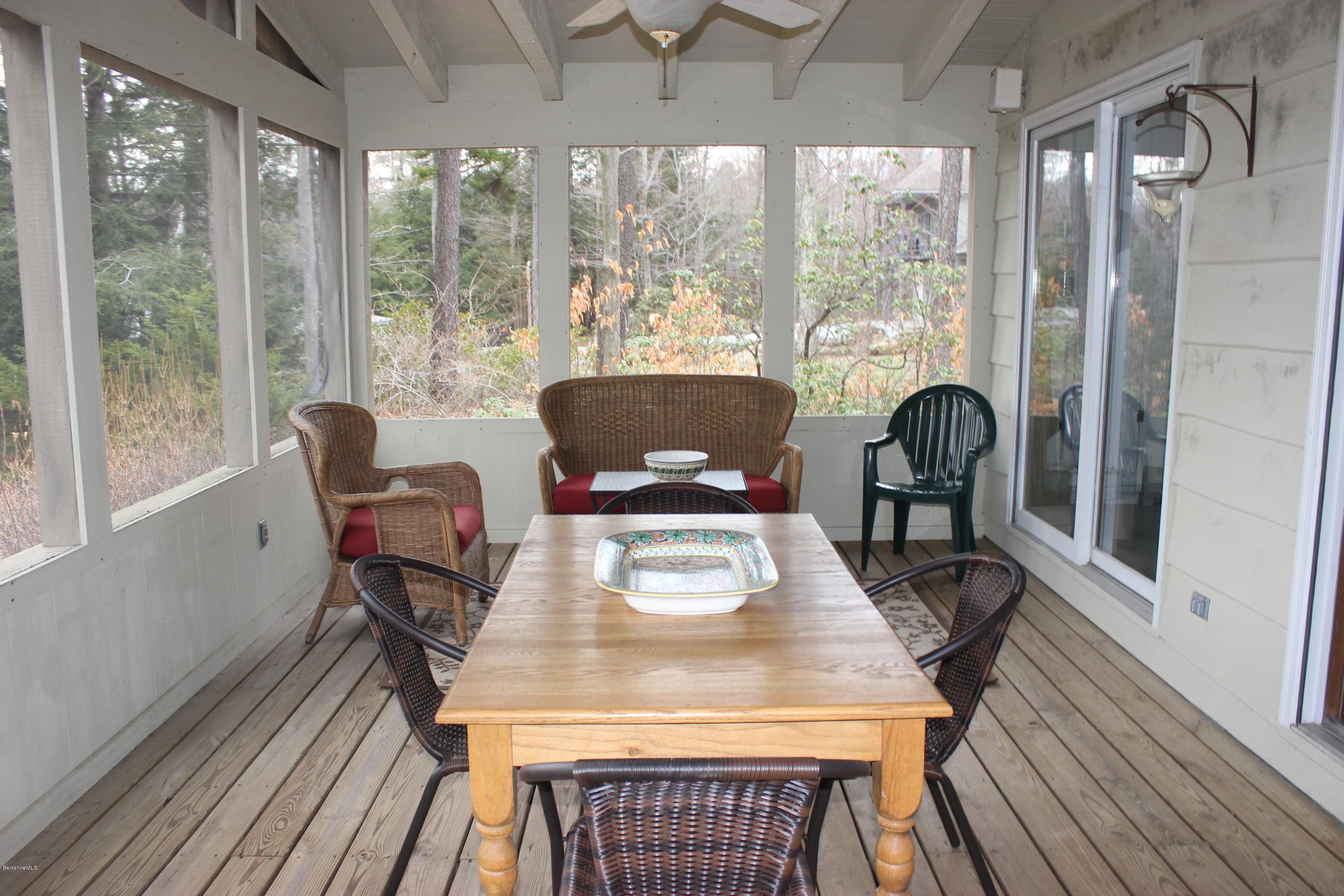 40 Williams Road Becket, MA 01223 - Photo 15 of 18 a view of a dining room with furniture window and wooden floor