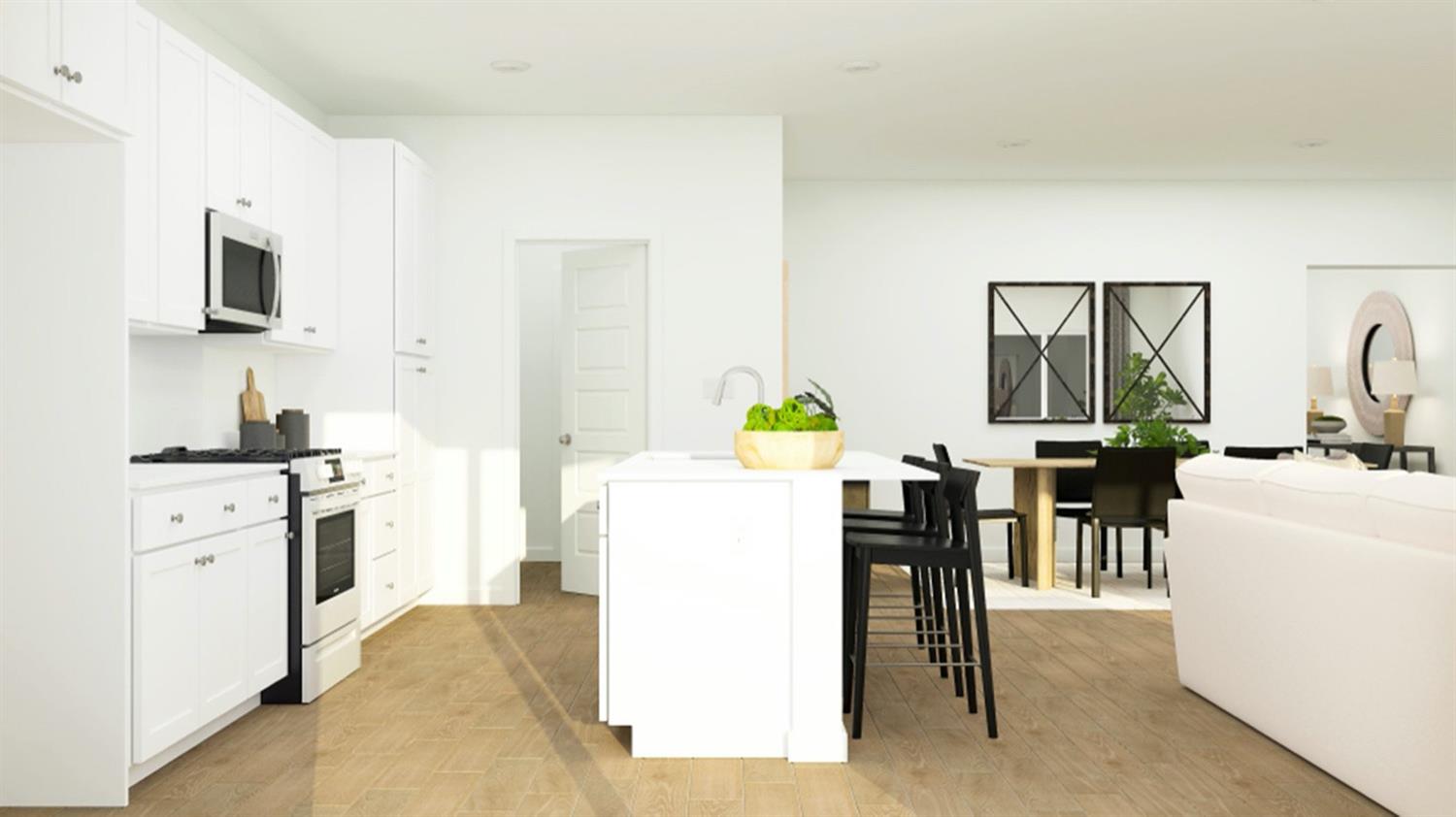 1260 Bloom Avenue, Unit 34 Clovis, CA 93619 - Photo 3 of 14 a kitchen with a white cabinets and chairs