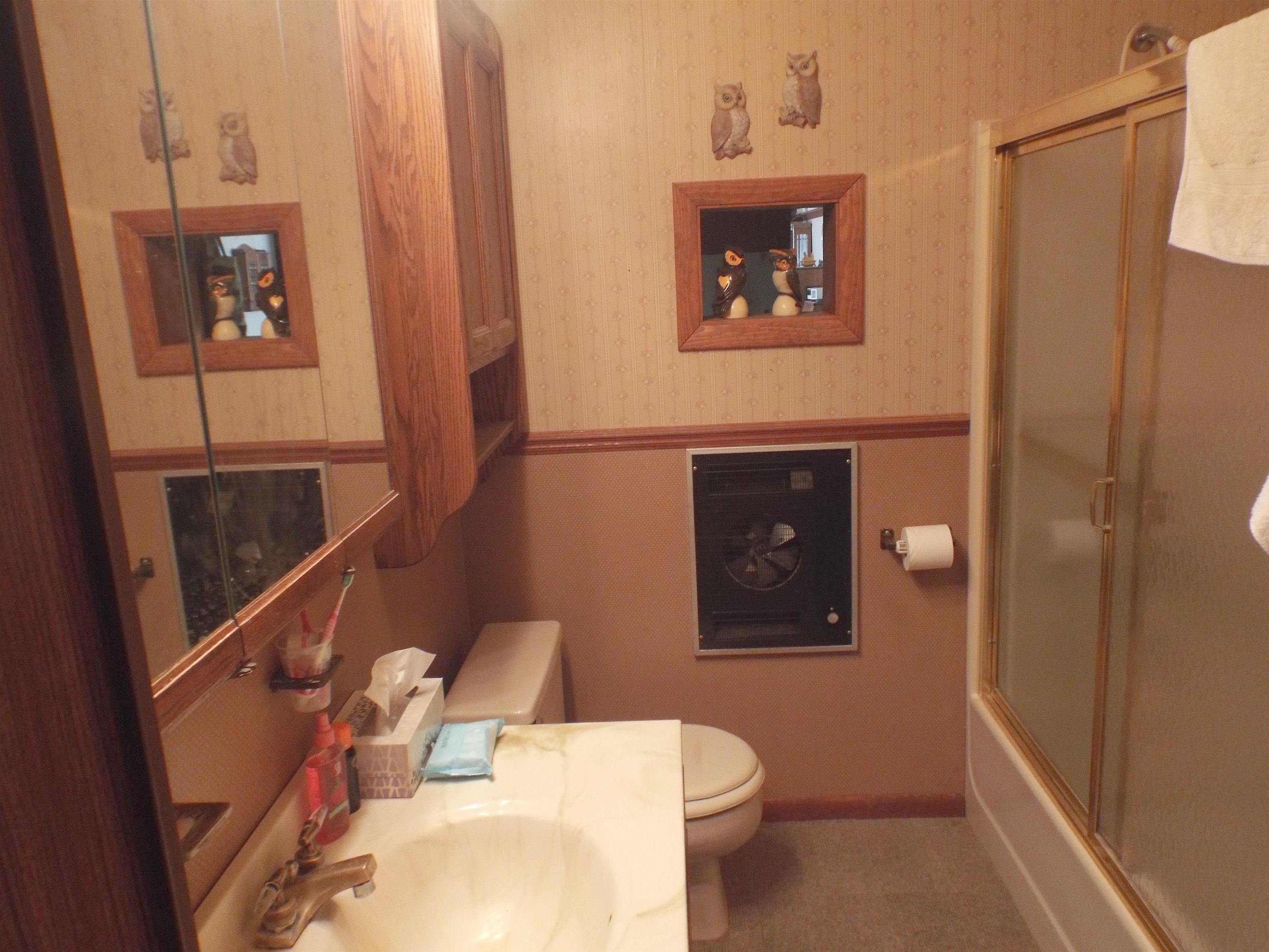 133 Mathilda Drive Stockton, IL 61085 - Photo 12 of 15 a bathroom with a toilet a sink and shower