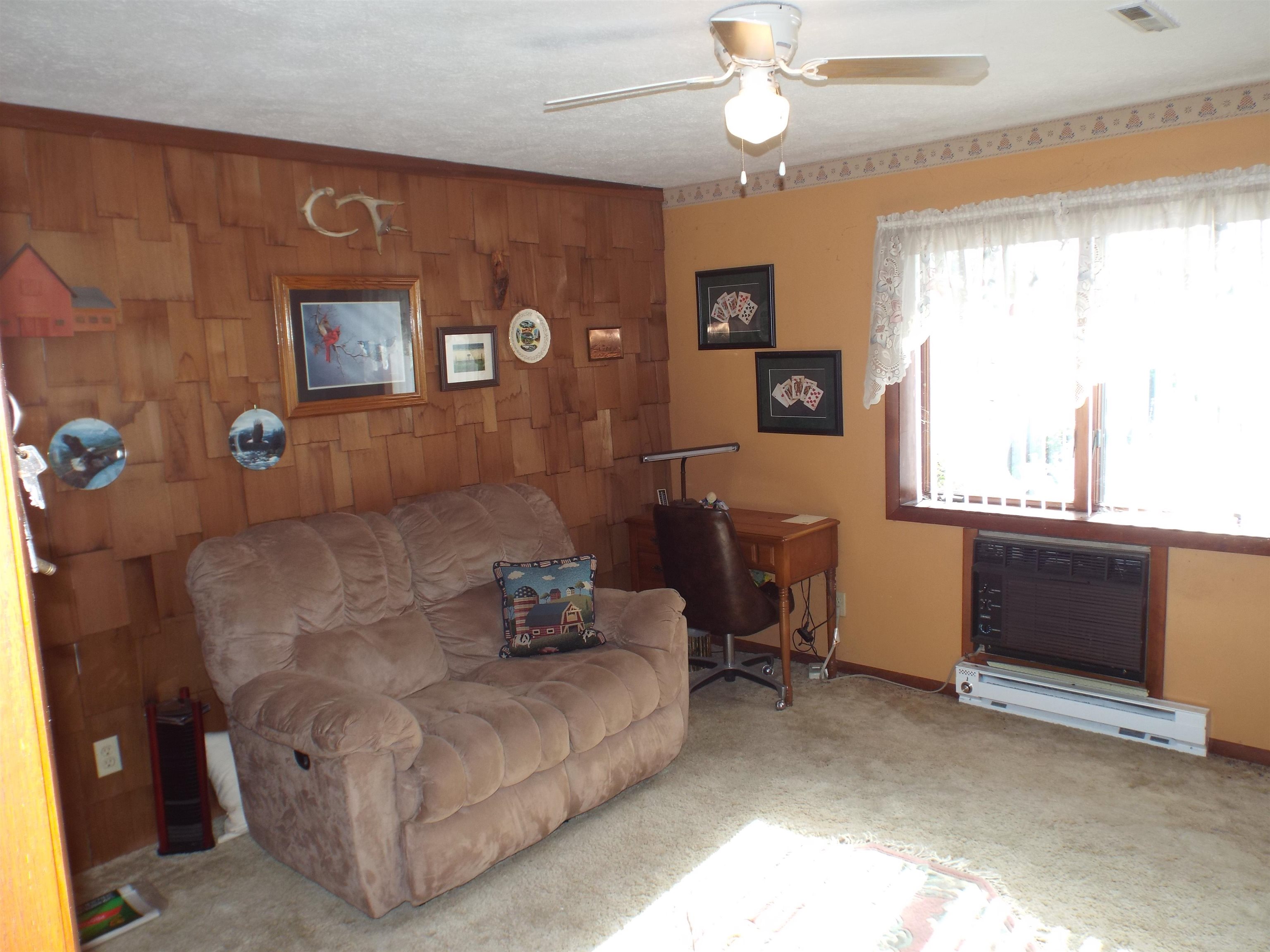 133 Mathilda Drive Stockton, IL 61085 - Photo 7 of 15 a living room with furniture and a window