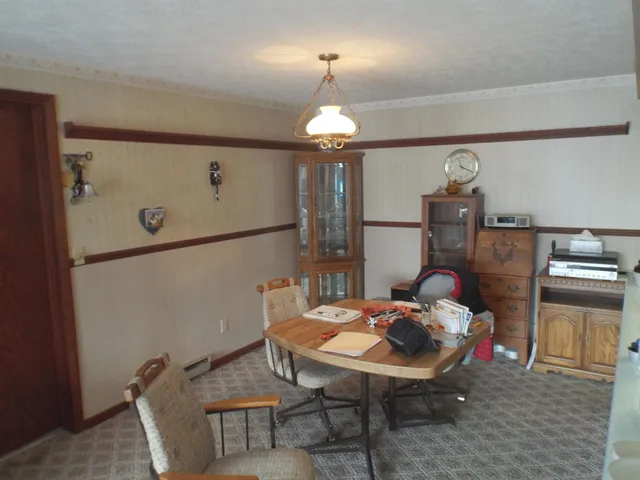 a dining room with furniture and window