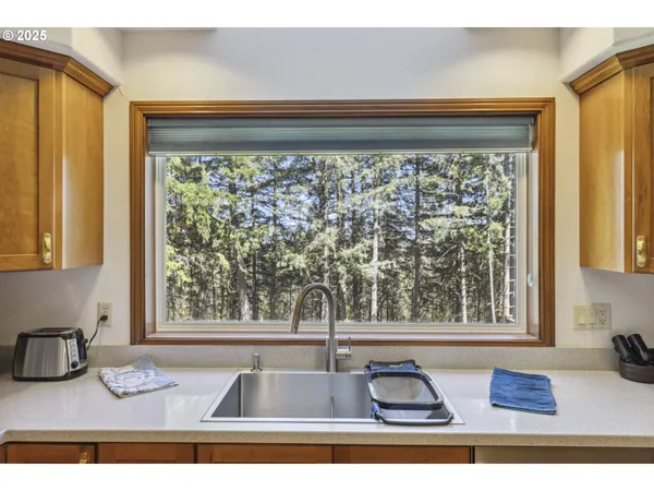 a kitchen with stainless steel appliances granite countertop a stove and a sink