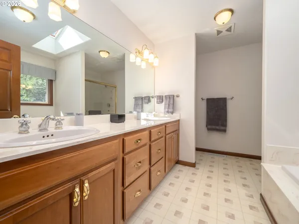 a bathroom with a bathtub and a sink