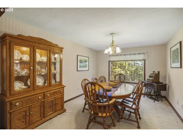 a picture of a floor to ceiling window and dining room