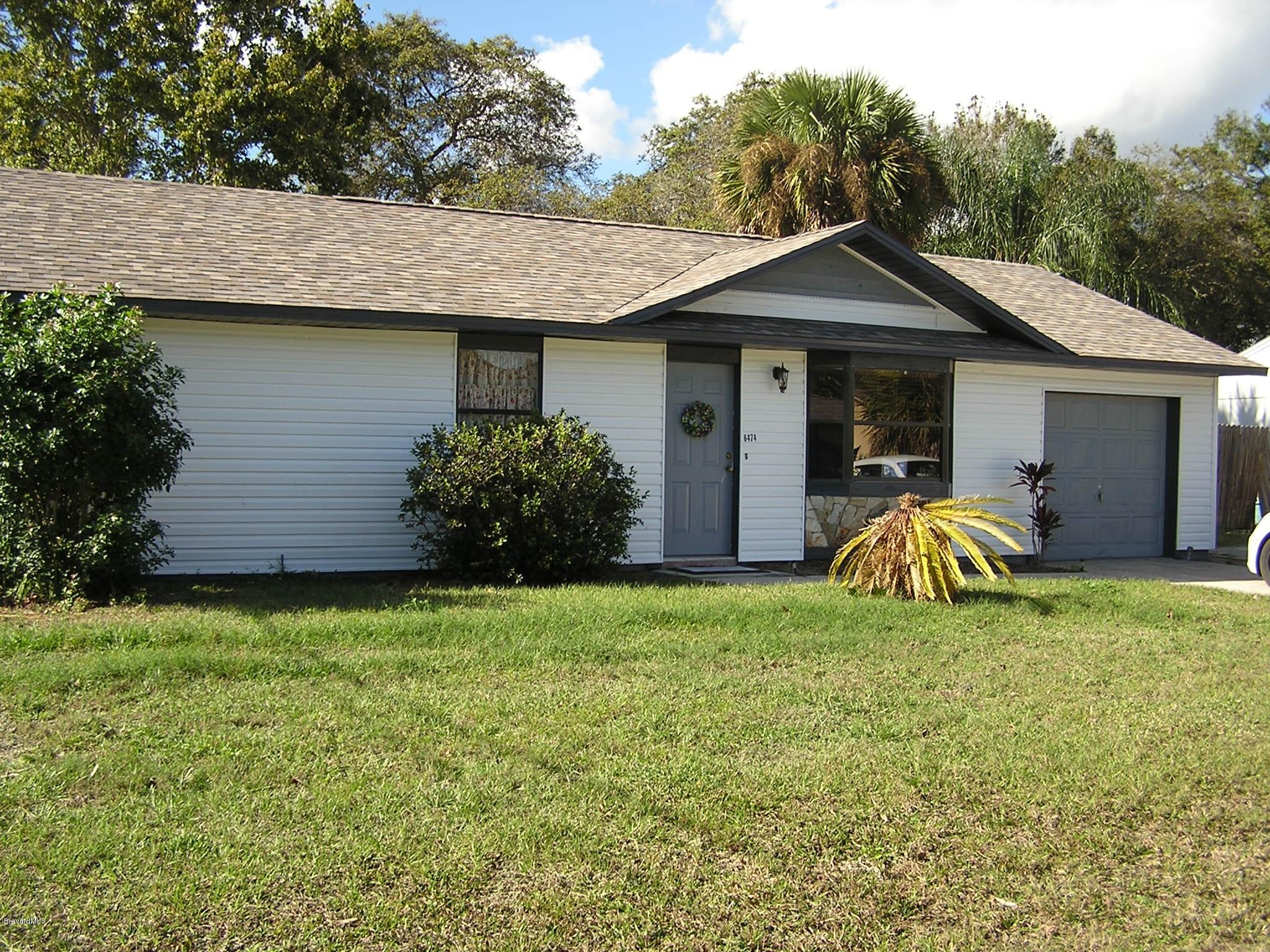 6474 Hudson Road Cocoa, FL 32927 - Photo 1 of 9 a view of a back yard of the house