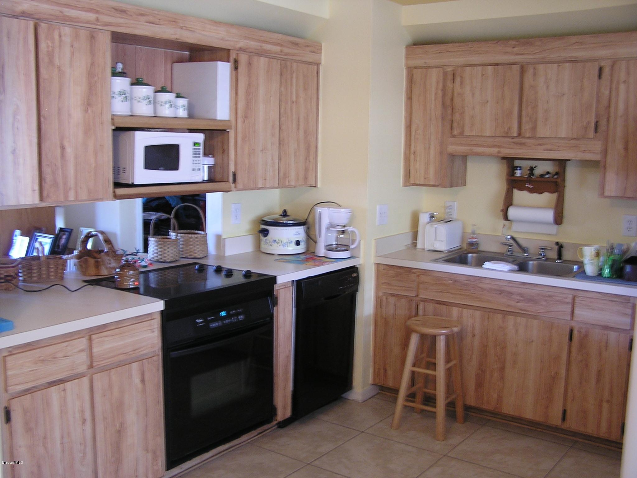 6474 Hudson Road Cocoa, FL 32927 - Photo 2 of 9 a kitchen with a sink cabinets and window