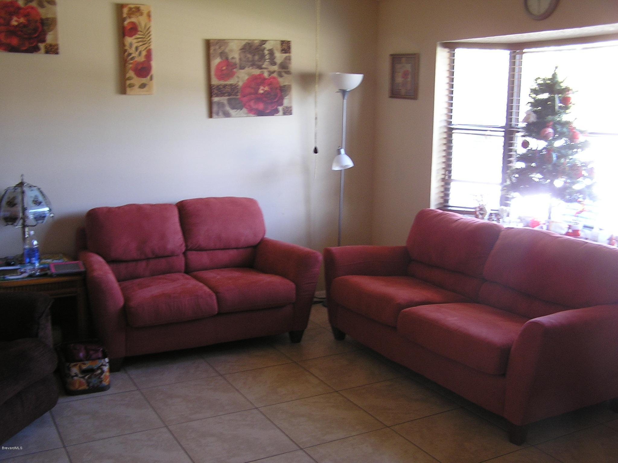6474 Hudson Road Cocoa, FL 32927 - Photo 3 of 9 a living room with furniture and a window