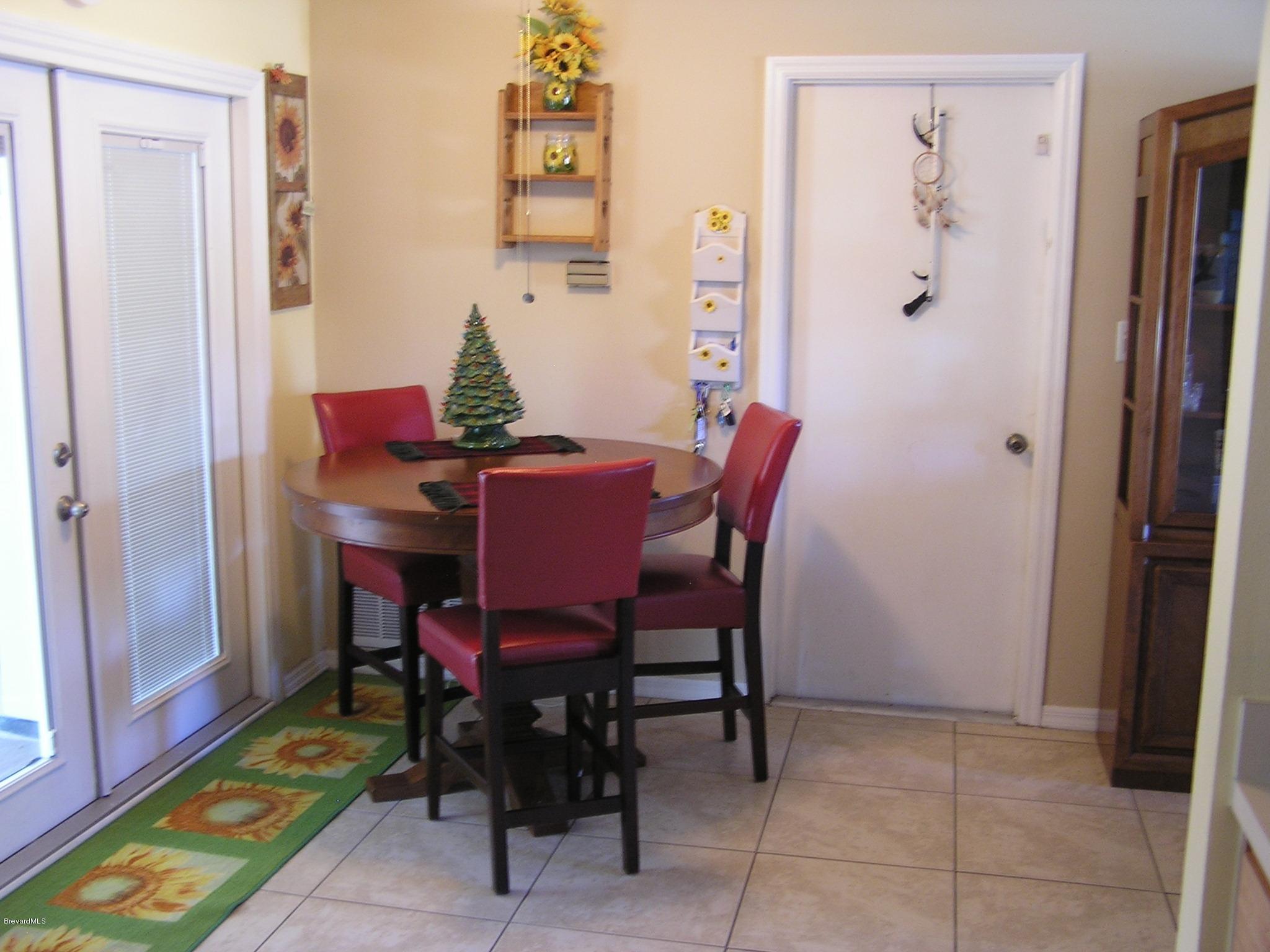 6474 Hudson Road Cocoa, FL 32927 - Photo 5 of 9 a view of a dining room with furniture