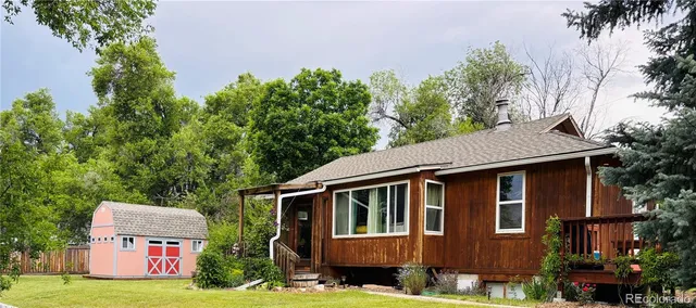 a front view of a house with yard