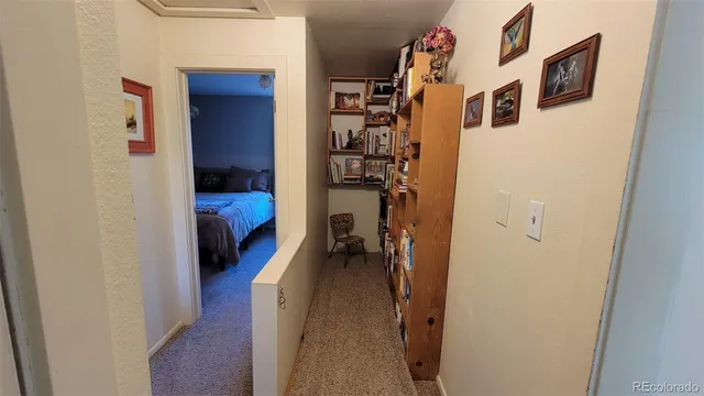a view of living room with furniture and a window