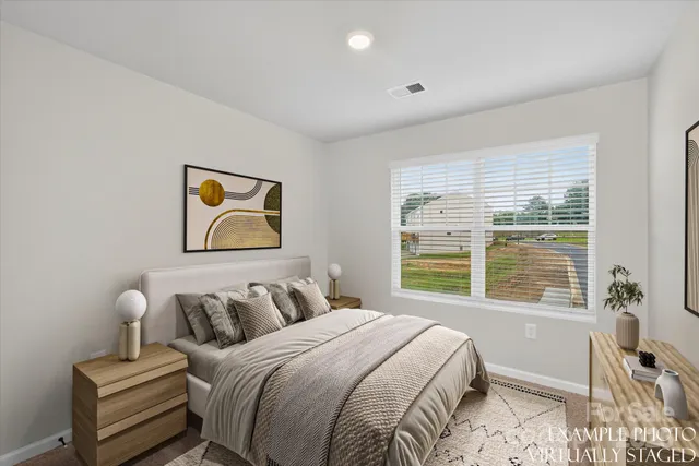 a bedroom with bed and a window