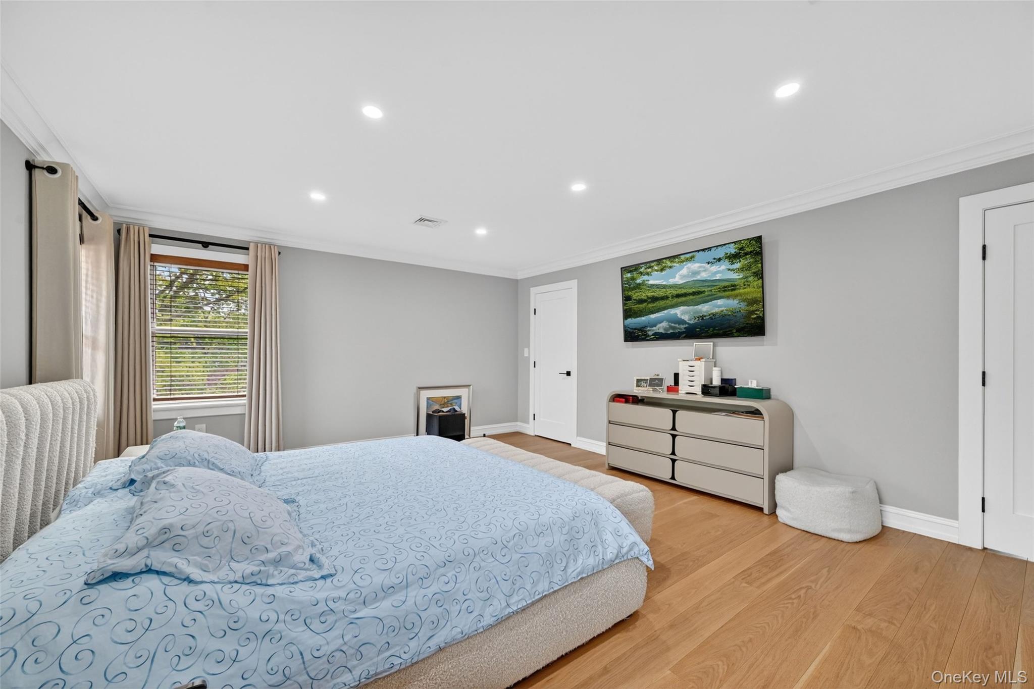 65 Wildway Bronxville, NY 10708 - Photo 33 of 42 Spacious room featuring wood-finish flooring, recessed lighting, and crown molding