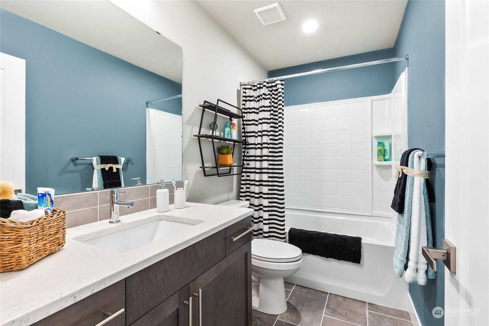 119 177th Street Southeast Bothell, WA 98012 - Photo 30 of 32 a bathroom with a sink a toilet and a mirror