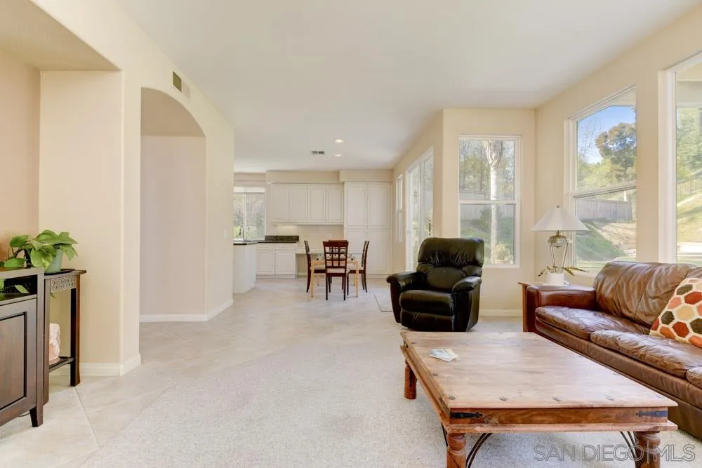 3224 Rancho Arroba Carlsbad, CA 92009 - Photo 11 of 35 a living room with furniture and a potted plant