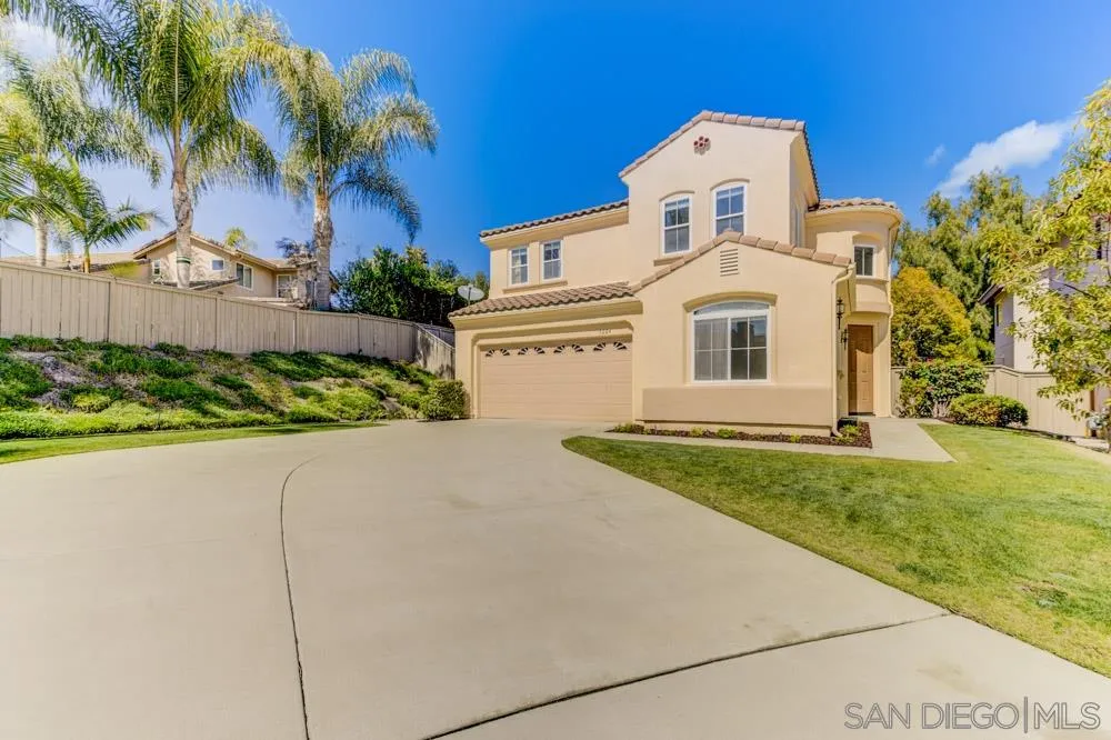 3224 Rancho Arroba Carlsbad, CA 92009 - Photo 2 of 35 a front view of a house with a garden
