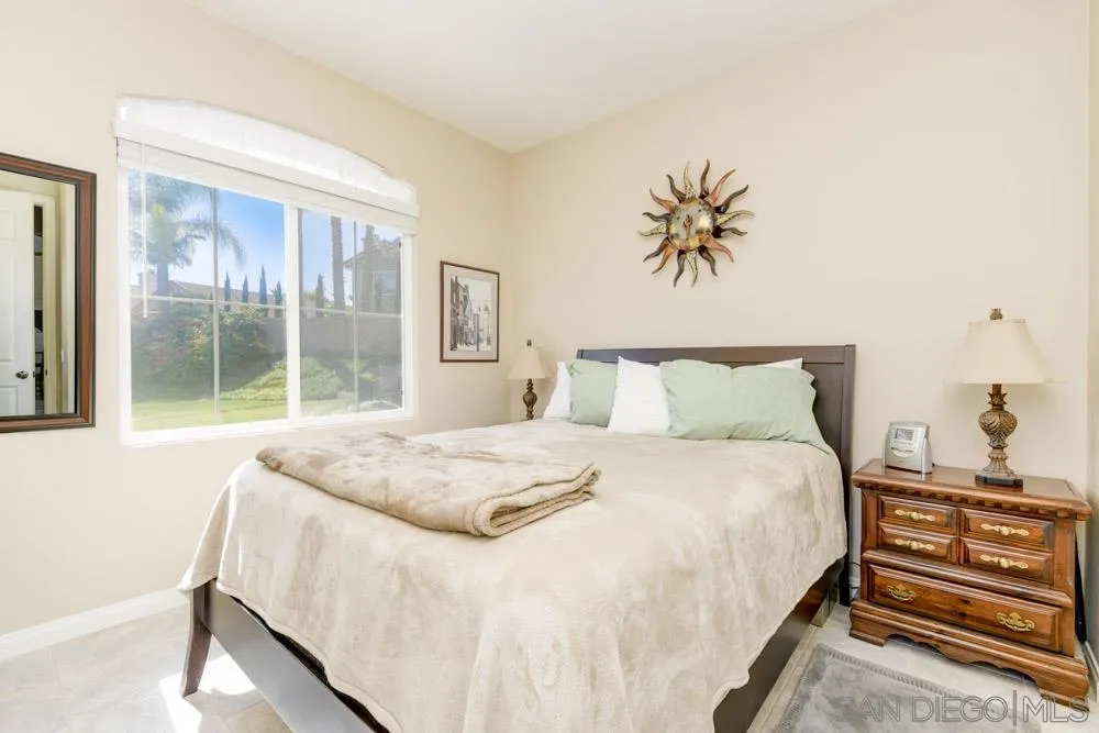 3224 Rancho Arroba Carlsbad, CA 92009 - Photo 23 of 35 a bedroom with a bed and a window