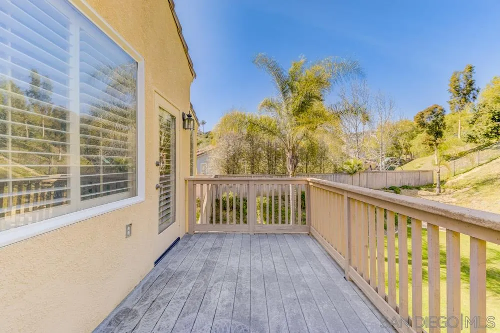 3224 Rancho Arroba Carlsbad, CA 92009 - Photo 30 of 35 a view of a balcony with wooden floor and fence