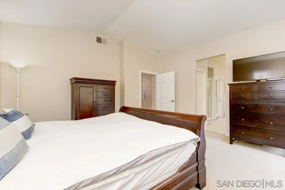 3224 Rancho Arroba Carlsbad, CA 92009 - Photo 32 of 35 a bedroom with a bed and a dresser
