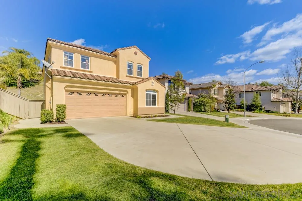 3224 Rancho Arroba Carlsbad, CA 92009 - Photo 4 of 35 a front view of a house with a garden and yard