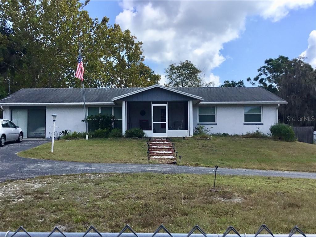 12538 Hicks Road Hudson, FL 34669 - Photo 1 of 1 Curb appeal. Circular drive. Fenced. Ample parking.