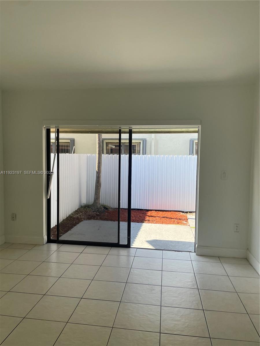 5216 West 24th Way, Unit 17D Hialeah, FL 33016 - Photo 12 of 14 a view of a bathroom with a glass door