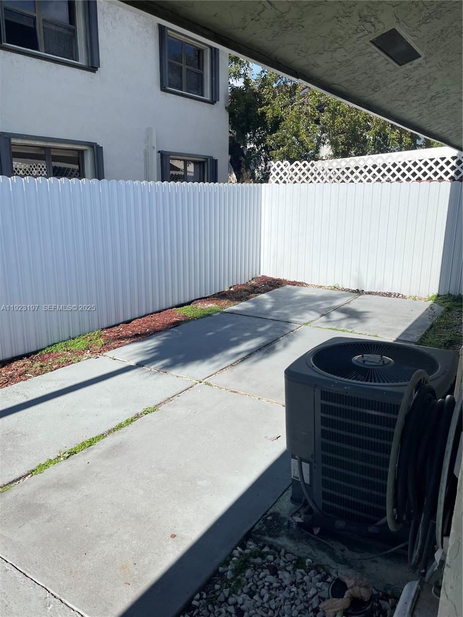 5216 West 24th Way, Unit 17D Hialeah, FL 33016 - Photo 13 of 14 a view of outdoor space and car parked