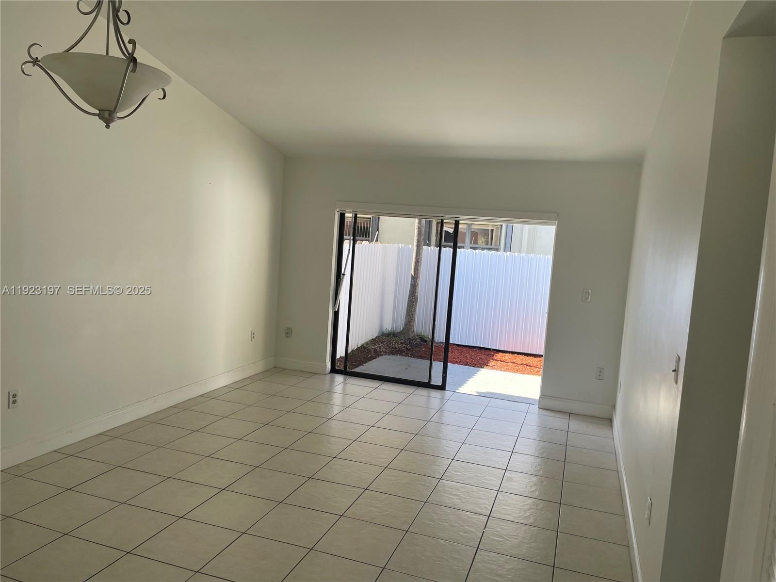 5216 West 24th Way, Unit 17D Hialeah, FL 33016 - Photo 5 of 14 a view of an empty room and entryway