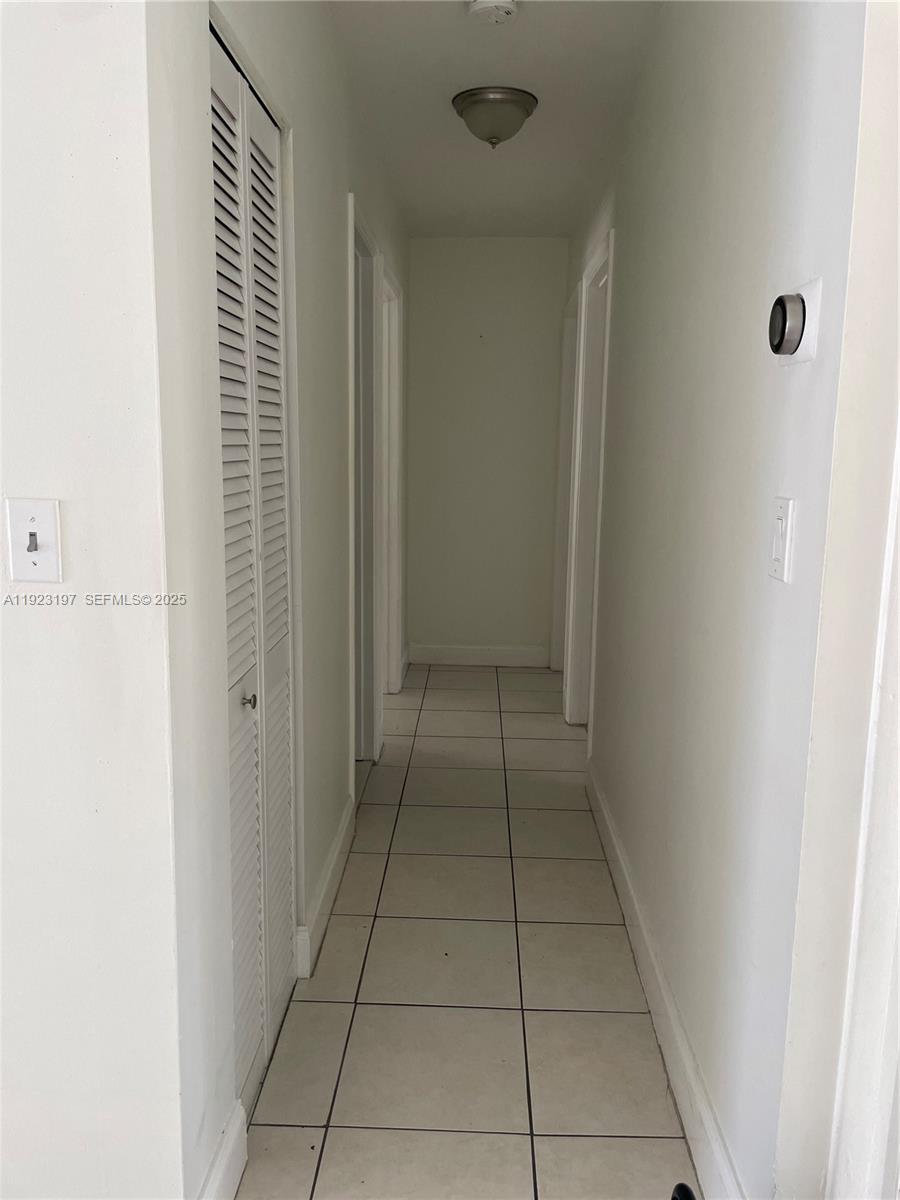 5216 West 24th Way, Unit 17D Hialeah, FL 33016 - Photo 6 of 14 a view of an empty room and a window