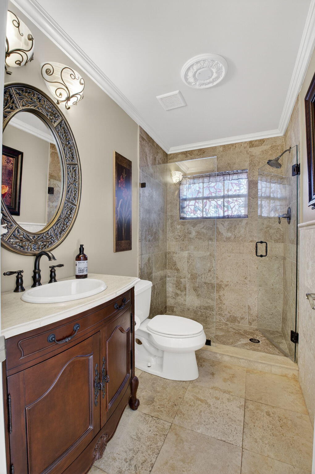 10570 Bexley Boulevard Boca Raton, FL 33428 - Photo 12 of 37 a bathroom with a toilet a sink and mirror