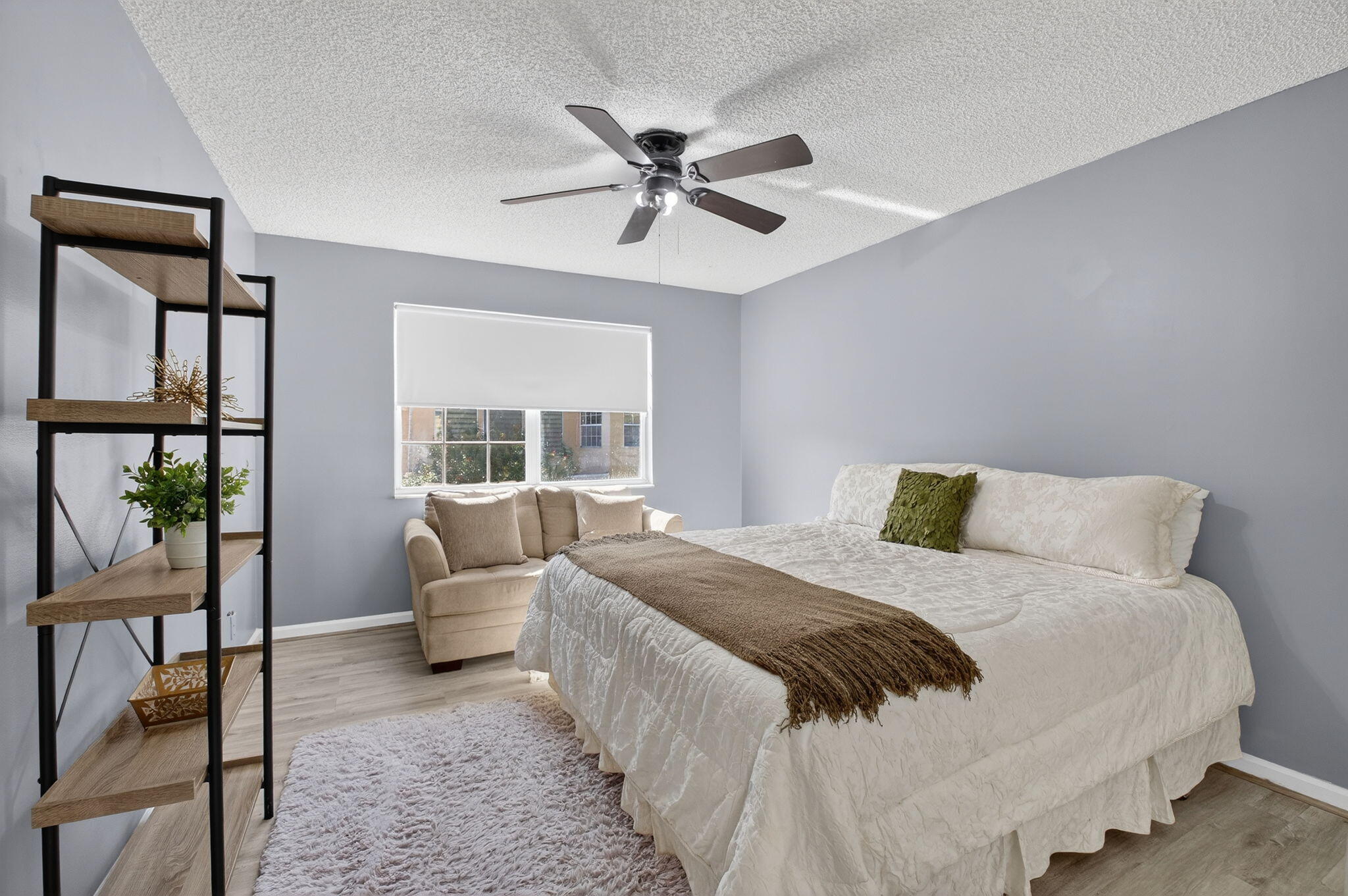 10570 Bexley Boulevard Boca Raton, FL 33428 - Photo 19 of 37 a bedroom with a bed and a large window